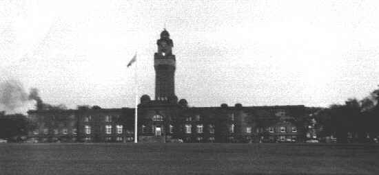 Clock tower above Headquarters, Ninth Naval District. Ross Field in foreground. Great Lakes, IL